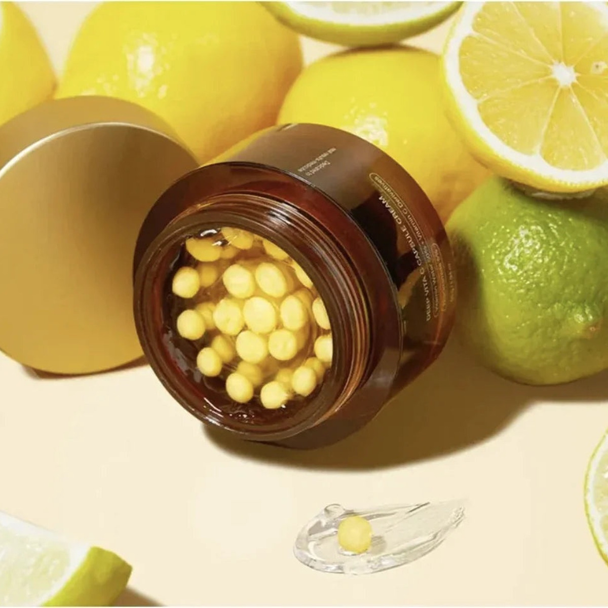 Deep Vita C Capsule Face Cream — editorial flat-lay with citrus and open capsule jar