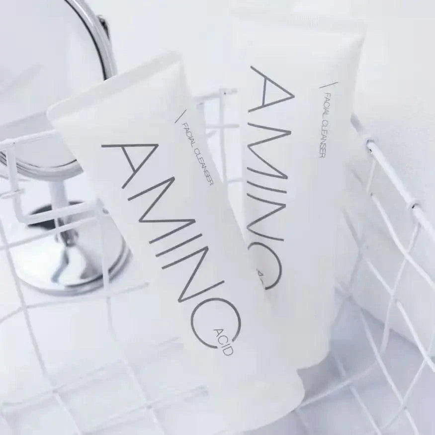 Two white bottles labeled 'AMINO' on a white background
