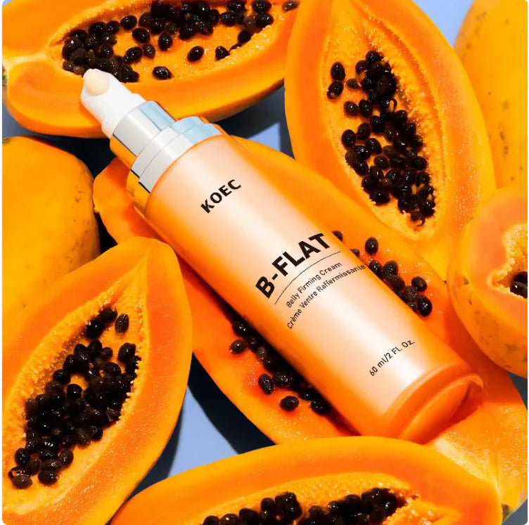 KOEC B-FLAT skincare bottle surrounded by sliced papayas with seeds