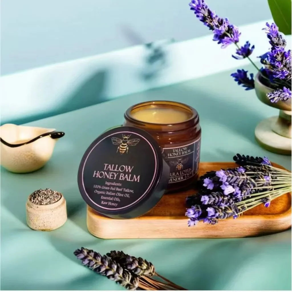 Tallow honey balm jar with lavender flowers on a light blue background