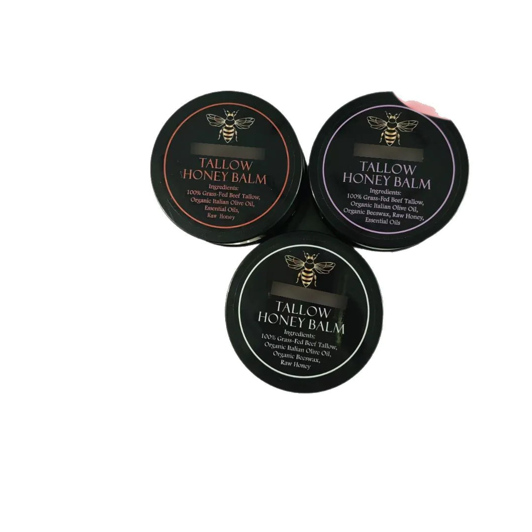 Three containers of Tallow Honey Balm on a white background