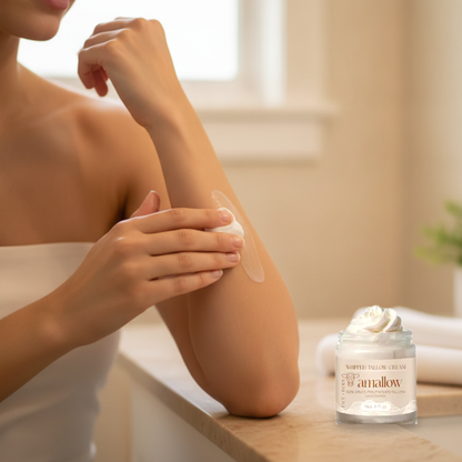 Applying Whipped Tallow Cream to the arm in a bathroom setting