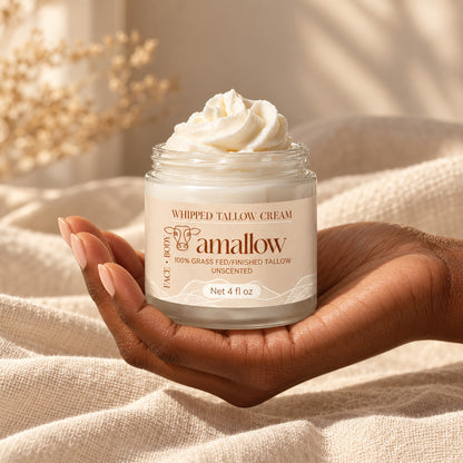 4 fl oz amallow whipped tallow jar resting in a hand for size