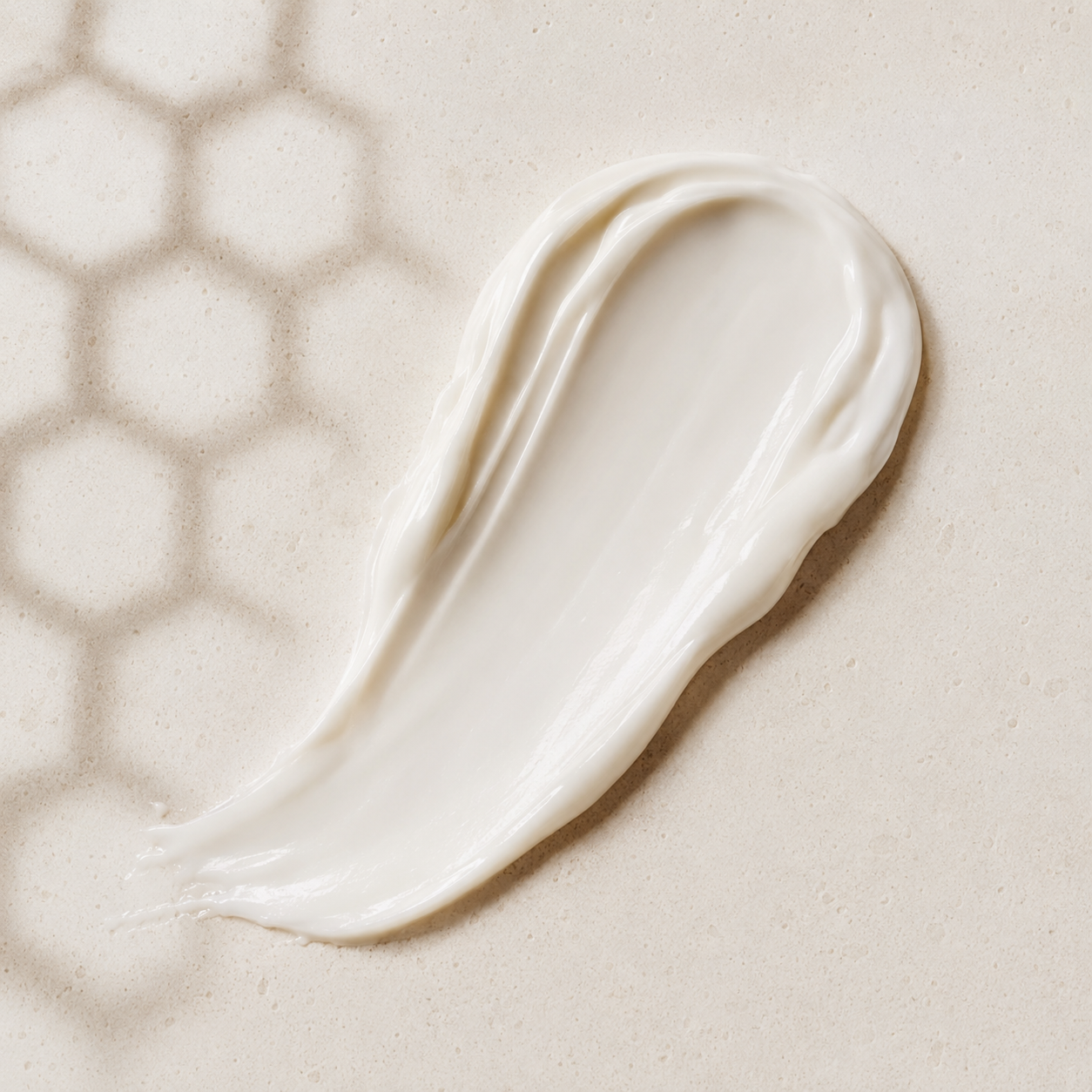 Hydrating white body moisturizer texture with honeycomb light pattern