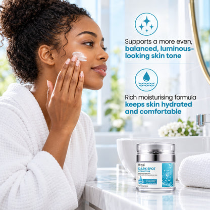 Woman applying dark spot cream for a more even, luminous-looking skin tone