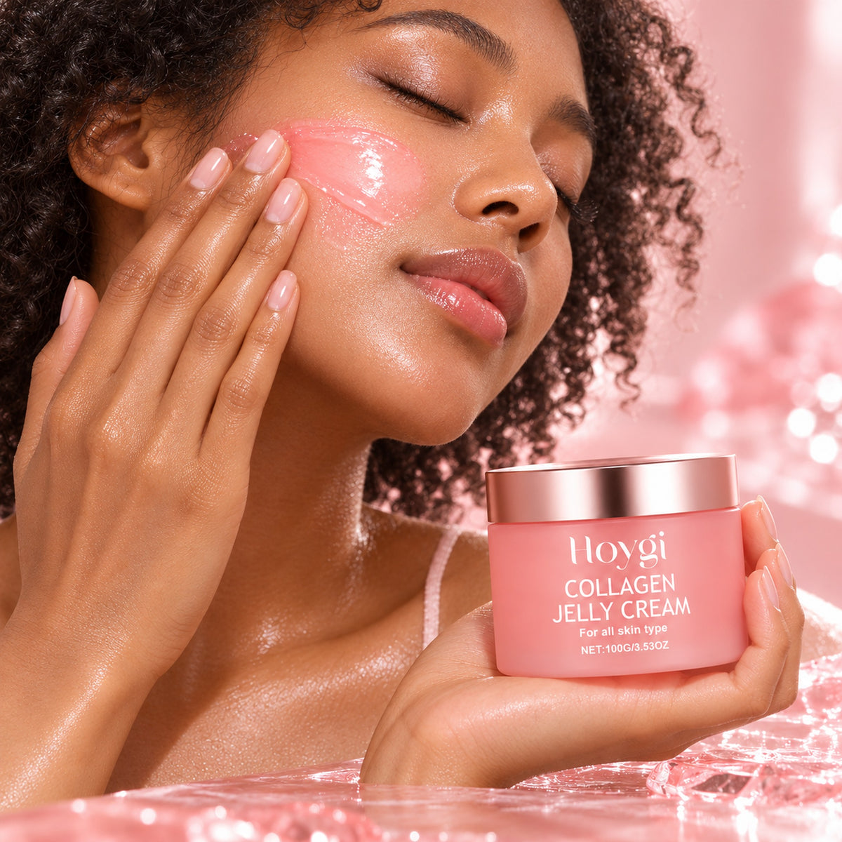 Woman smoothing pink jelly cream onto her cheek