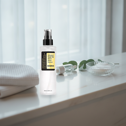 Snail 96 Mucin Power Essence — on a bright bathroom shelf in morning light