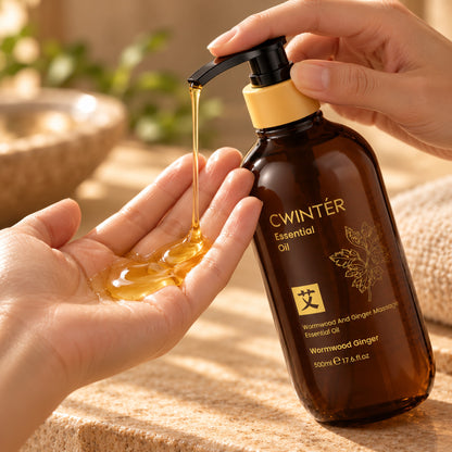Golden Wormwood Ginger massage oil pumped into an open palm