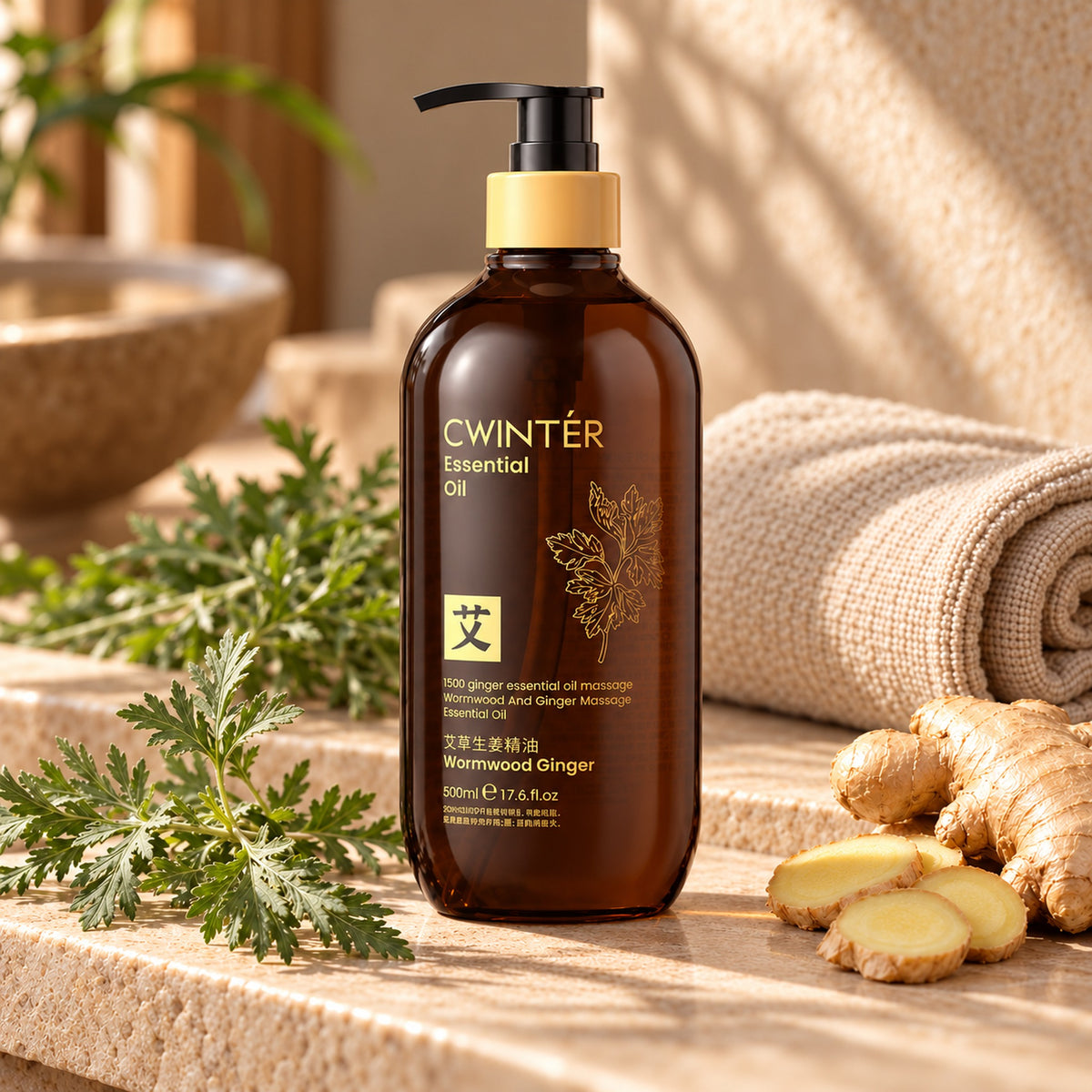 CWINTÉR Wormwood Ginger essential oil 500ml on a stone spa ledge with wormwood and fresh ginger