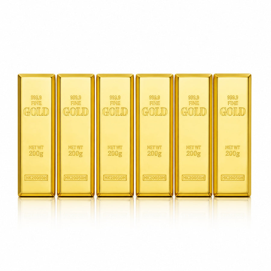 Six gold-bar lipstick cases alone on white with soft realistic studio shadows