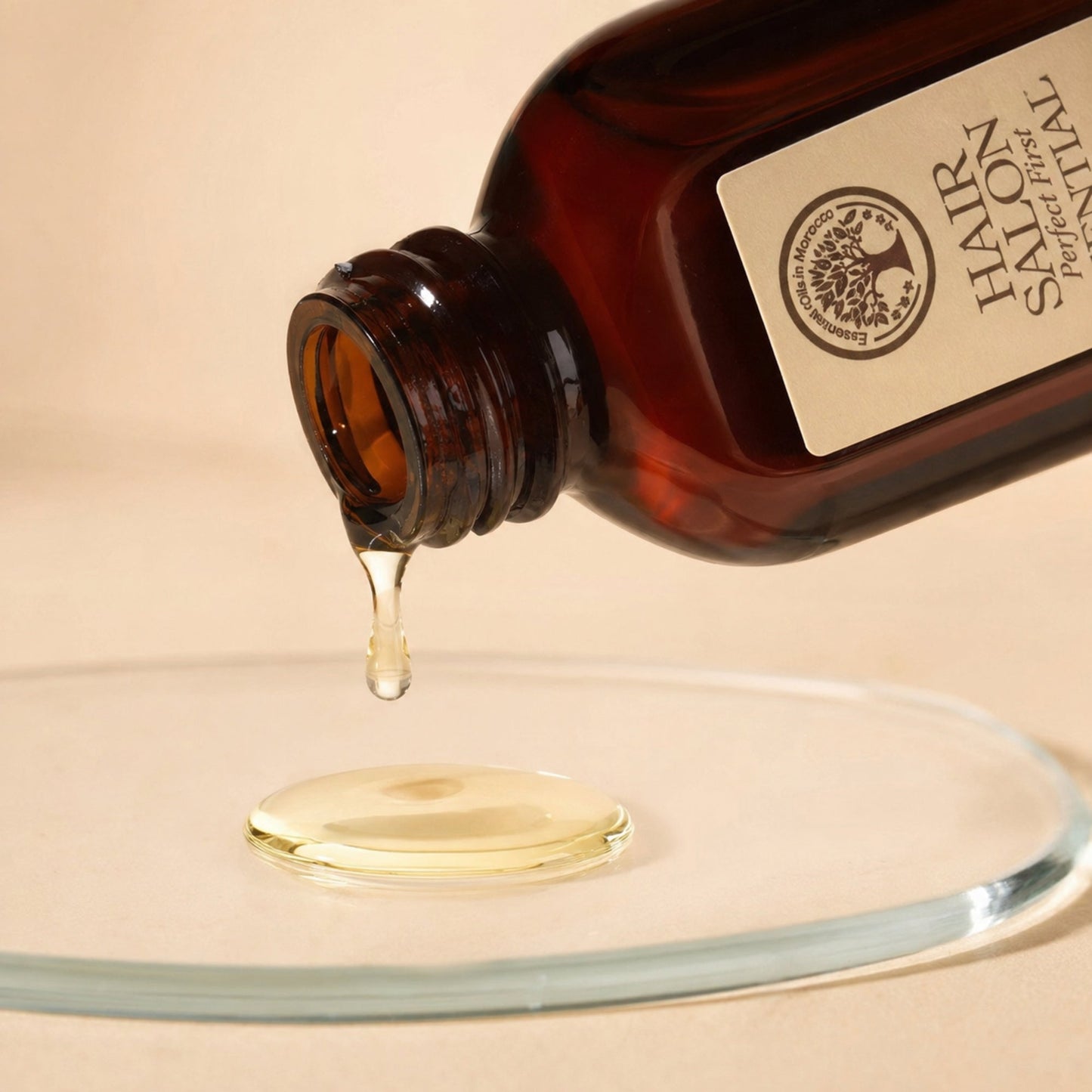 Hair Salon Essential Oil pouring a silky golden drop in macro detail