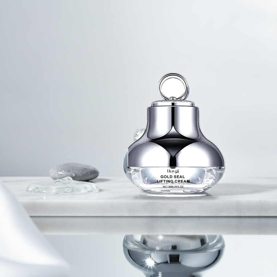 Hoygi Gold Seal Lifting Cream — styled on polished white marble with a clear gel pool