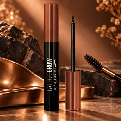 Tattoo Brow peel-off tint tube on copper and stone with brow brush