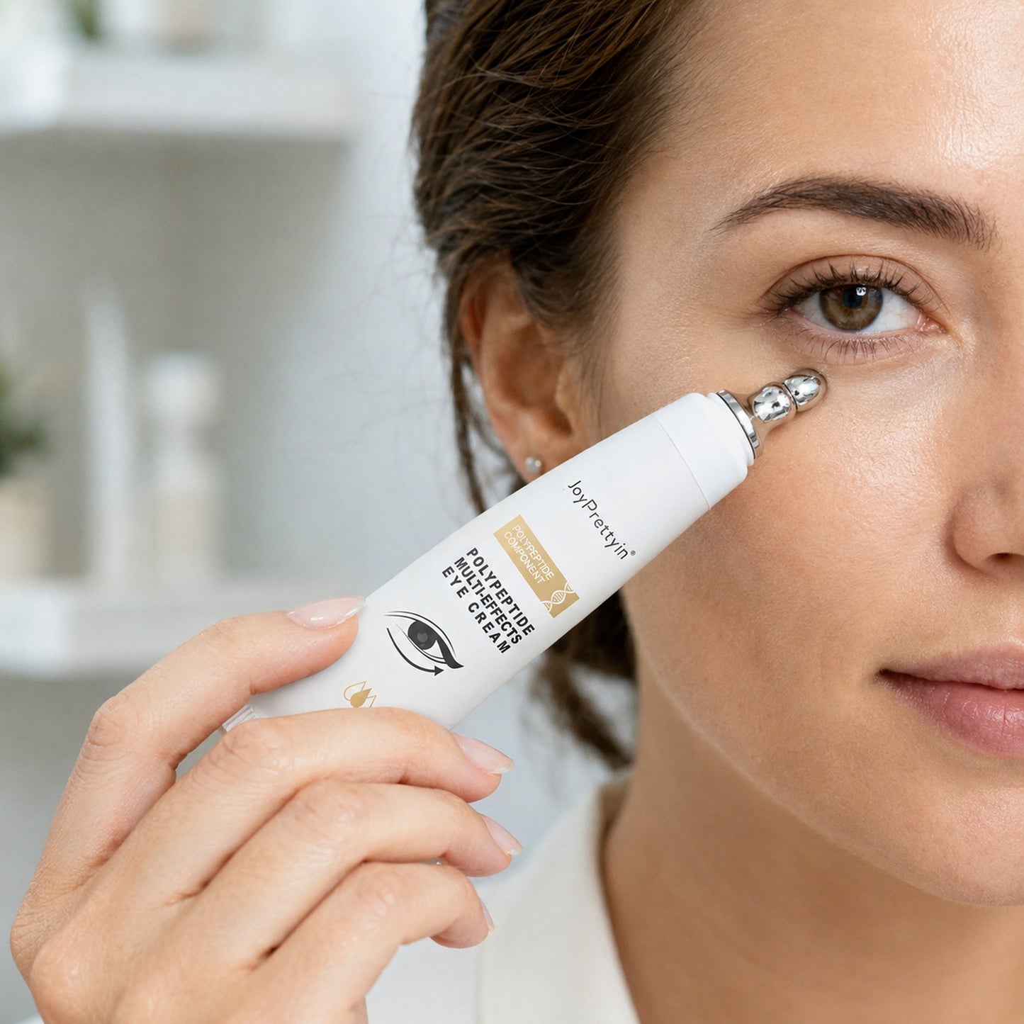 JoyPretty polypeptide eye cream being gently rolled under the eye during skincare
