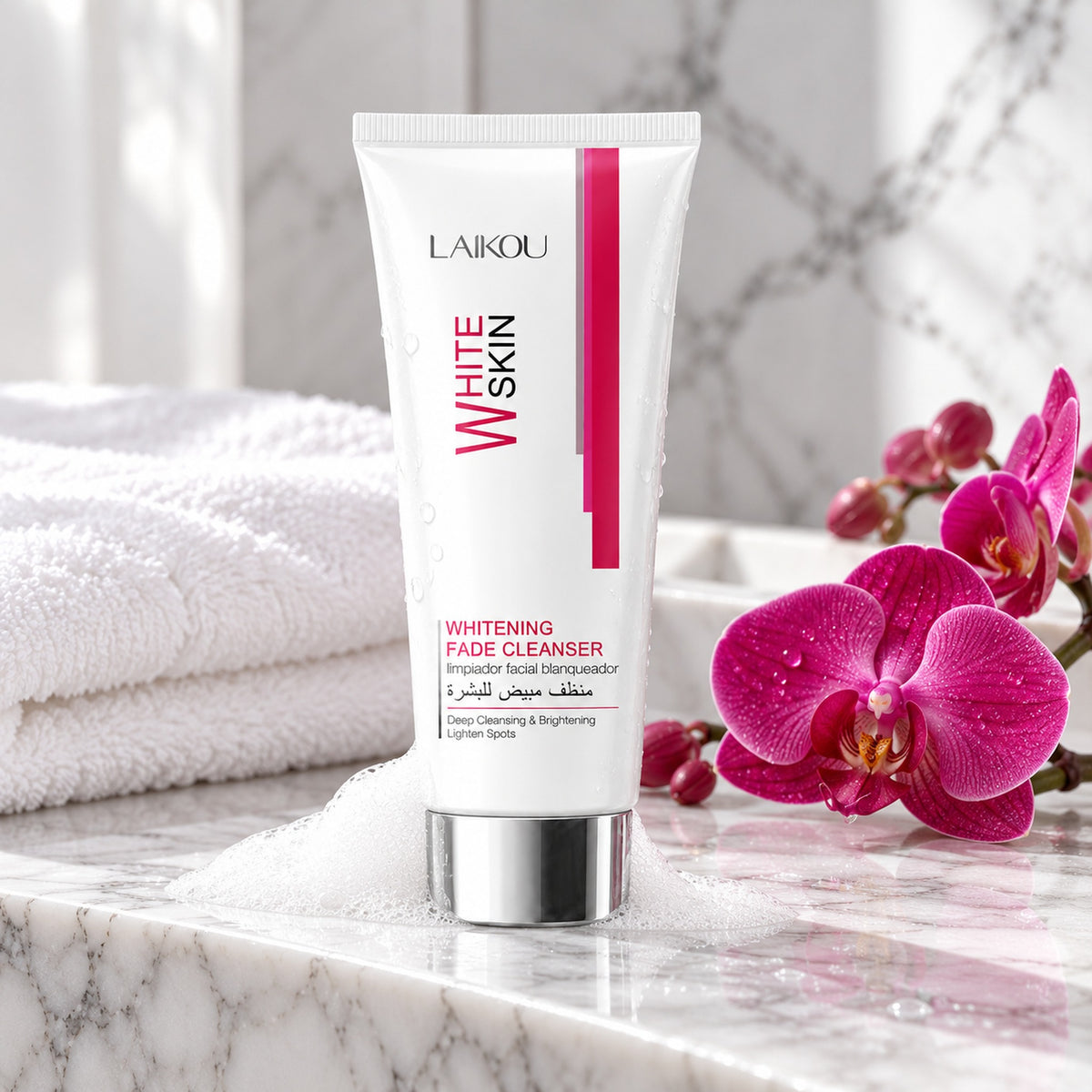 LAIKOU White Skin cleanser on a marble bath ledge with foam, towel and magenta orchid for a cleansing spa moment