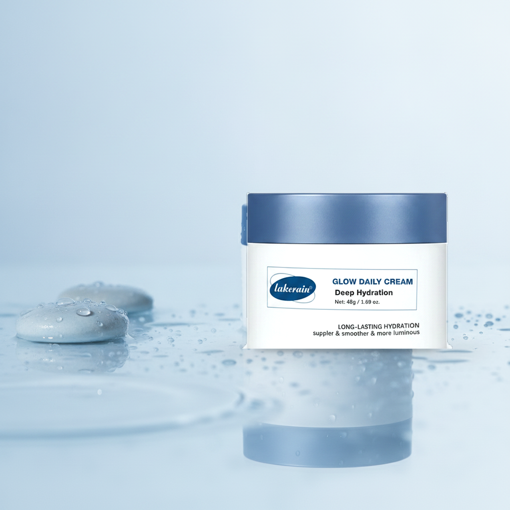 Lakerain Glow Daily Cream — styled on still water with droplets and wet stones