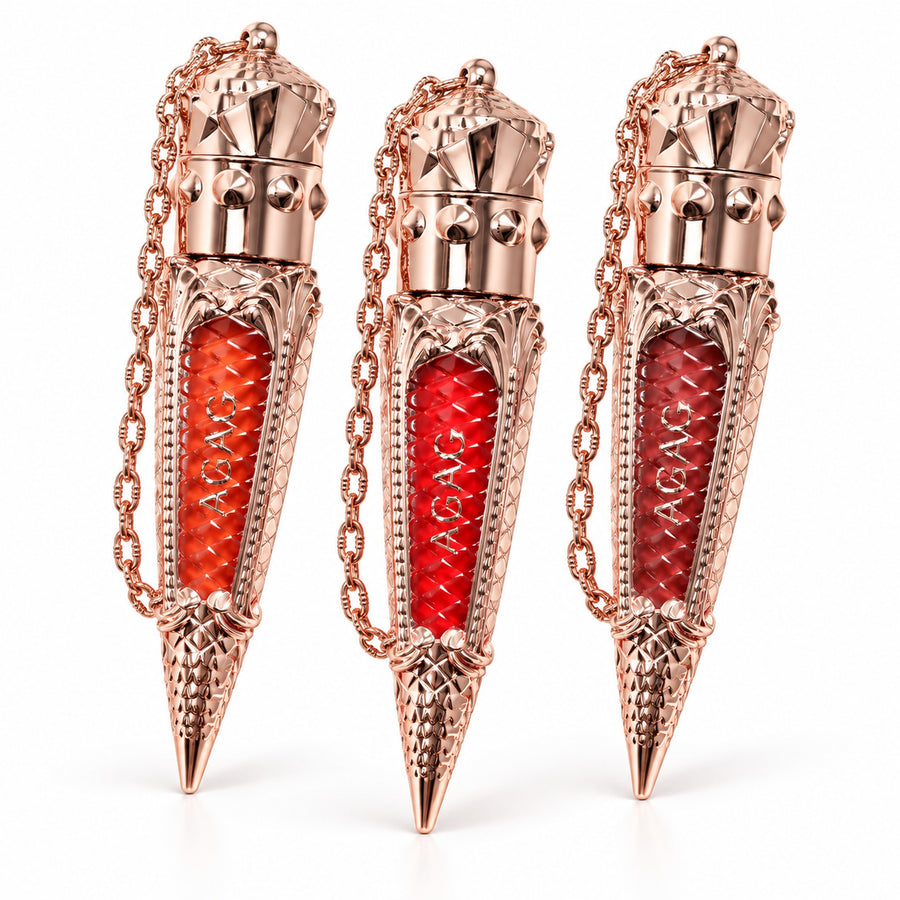 AGAG matte lip glaze in rose-gold crown tubes with chains, three shades, on white