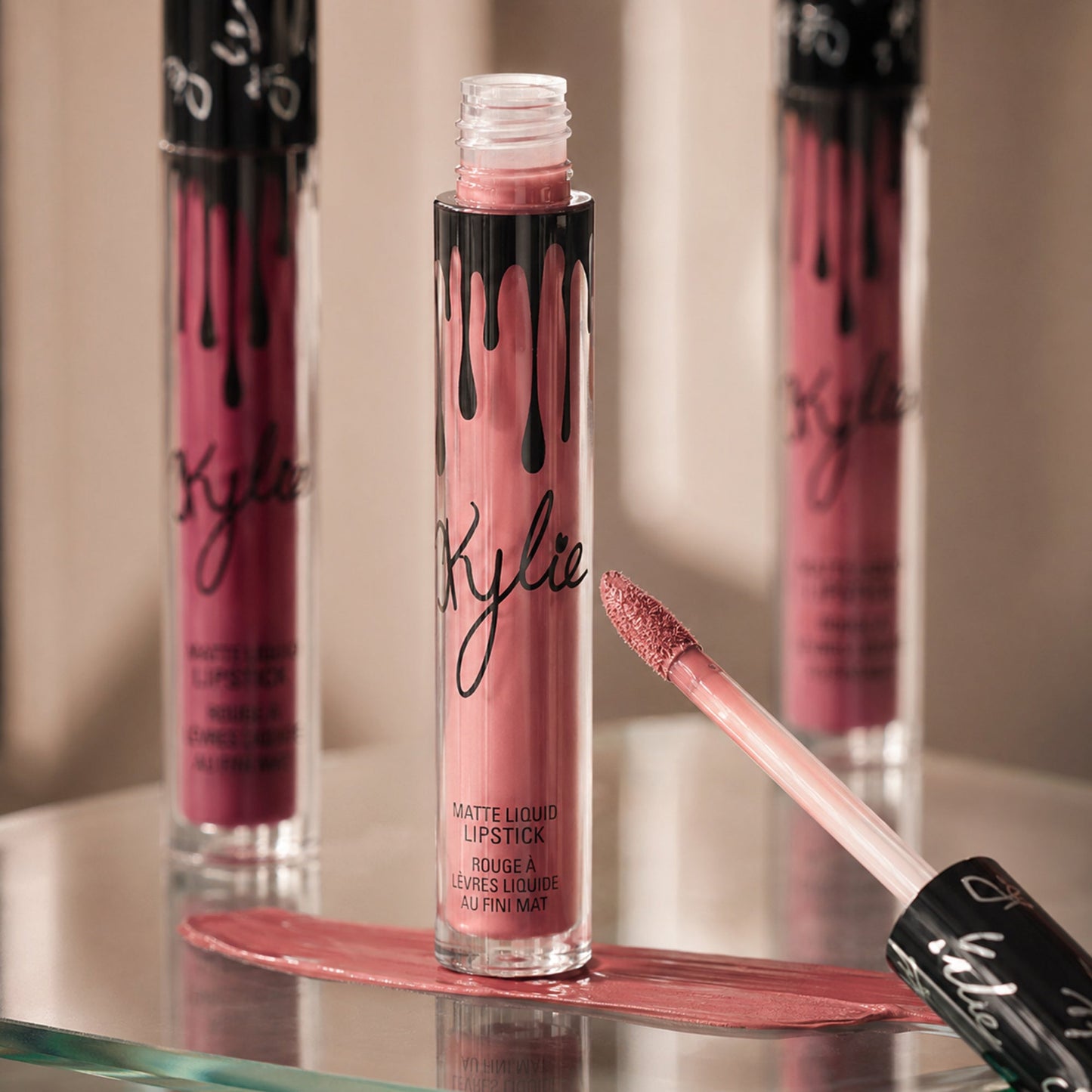 Matte liquid lipstick applicator and velvety rose color shown in macro detail