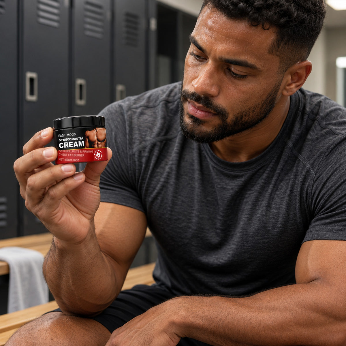 Bearded man in a gym locker room holding the 50 g East Moon chest cream jar