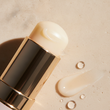 Snail Peptide Hydrating Eye Cream Stick — macro of the pearly balm nub and melted swipe