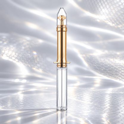 Snake Venom Peptide Eye Cream gold-and-clear applicator on a silver snake-scale surface