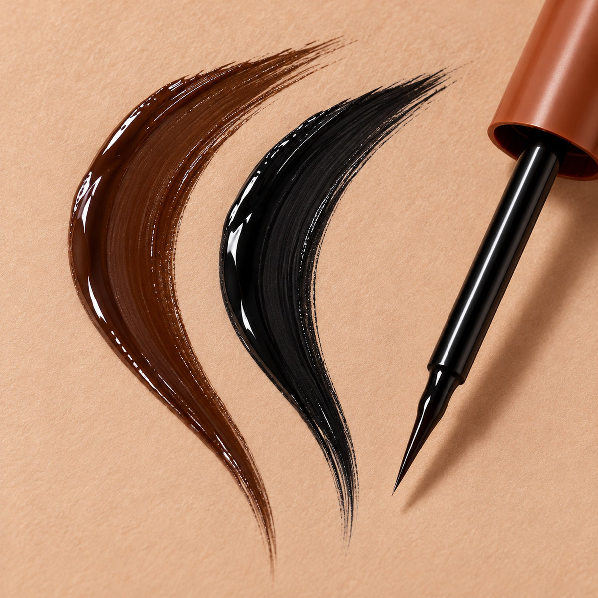 Dark brown and black peel-off brow gel strokes next to the brush tip