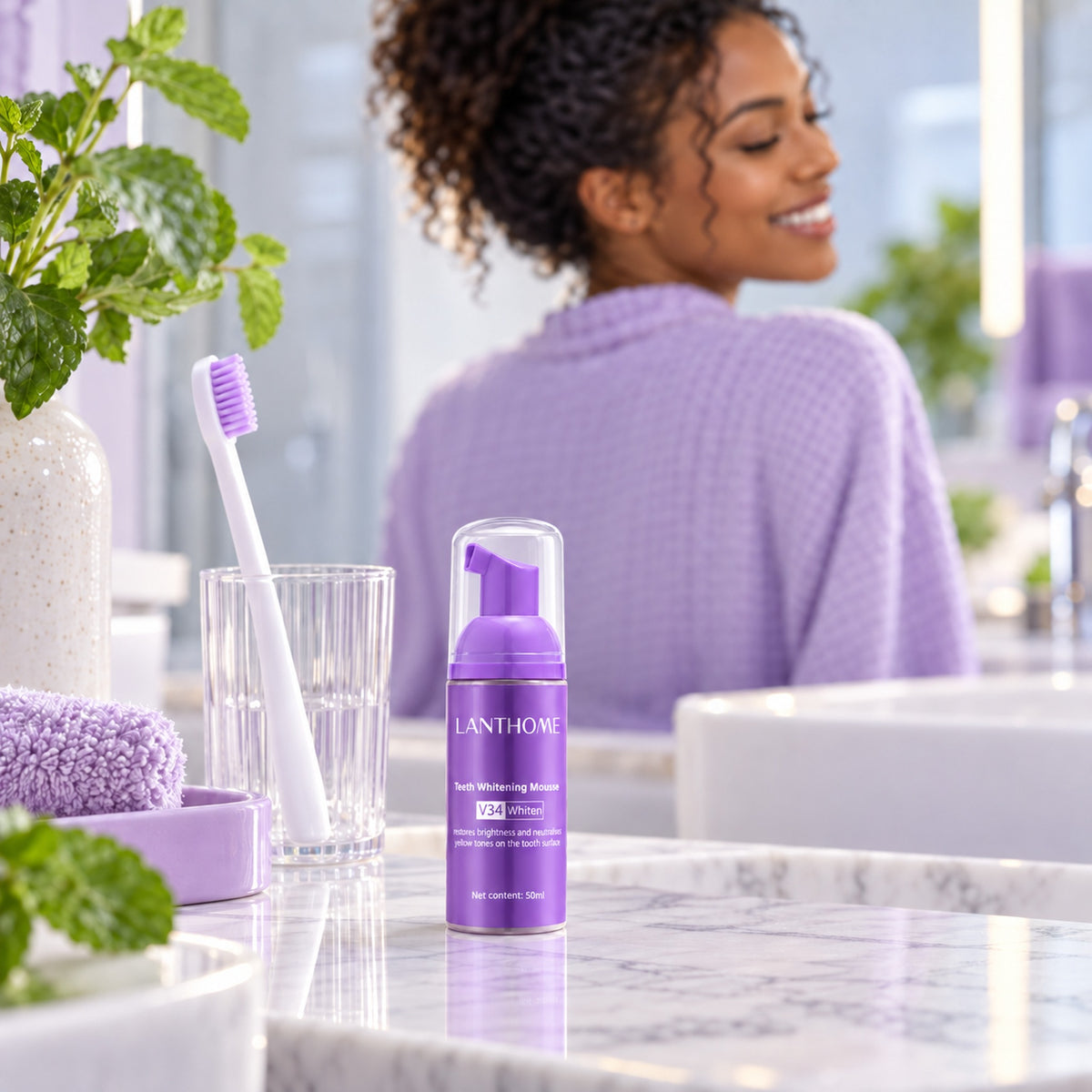 LANTHOME teeth whitening mousse on a bathroom vanity next to a toothbrush and glass
